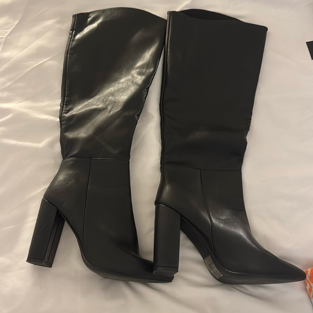 Below the knee black heeled boots